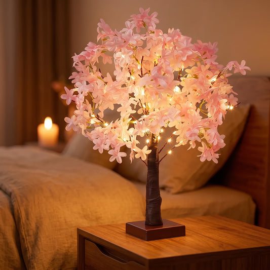 Lampe arbre fleuri Halume Hanami allumée, une LED dans chaque fleur, sur table de chevet