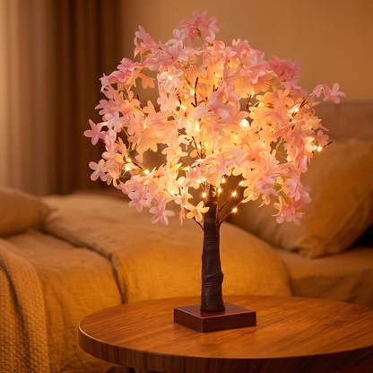Lampe arbre fleuri Halume Hanami, vue de trois quarts sur table de chevet