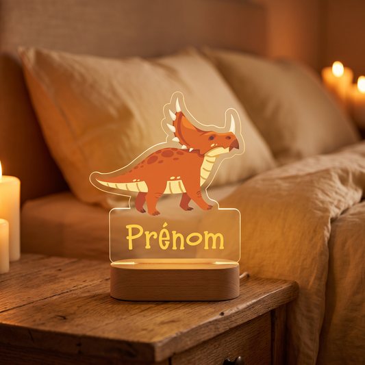 Veilleuse personnalisée Dinosaure en pléxiglas, prénom lumineux, gros plan table de chevet